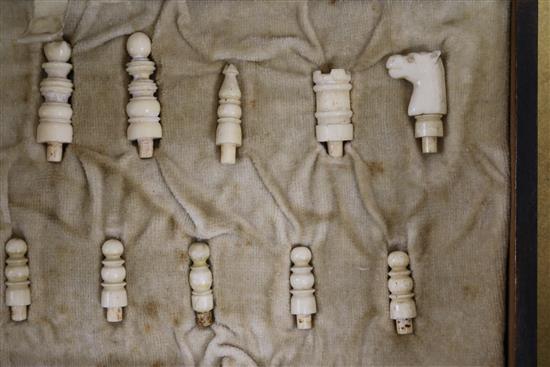 A bone travelling chess set and counters